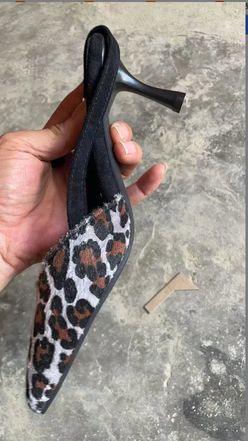 Women's leopard print suede sandals with pointed toe design on size display