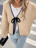 Women's grey lace-up cardigan sweater with crochet flower detail on front