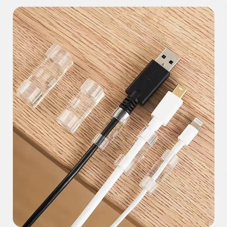 Transparent plastic self-adhesive cable routing snap clips in small, medium, large, and extra large sizes.