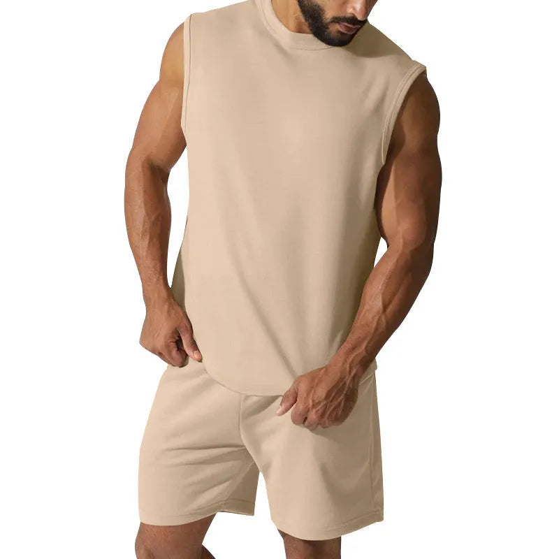 Men's sleeveless cotton blend sports top and matching shorts set in a solid colour.