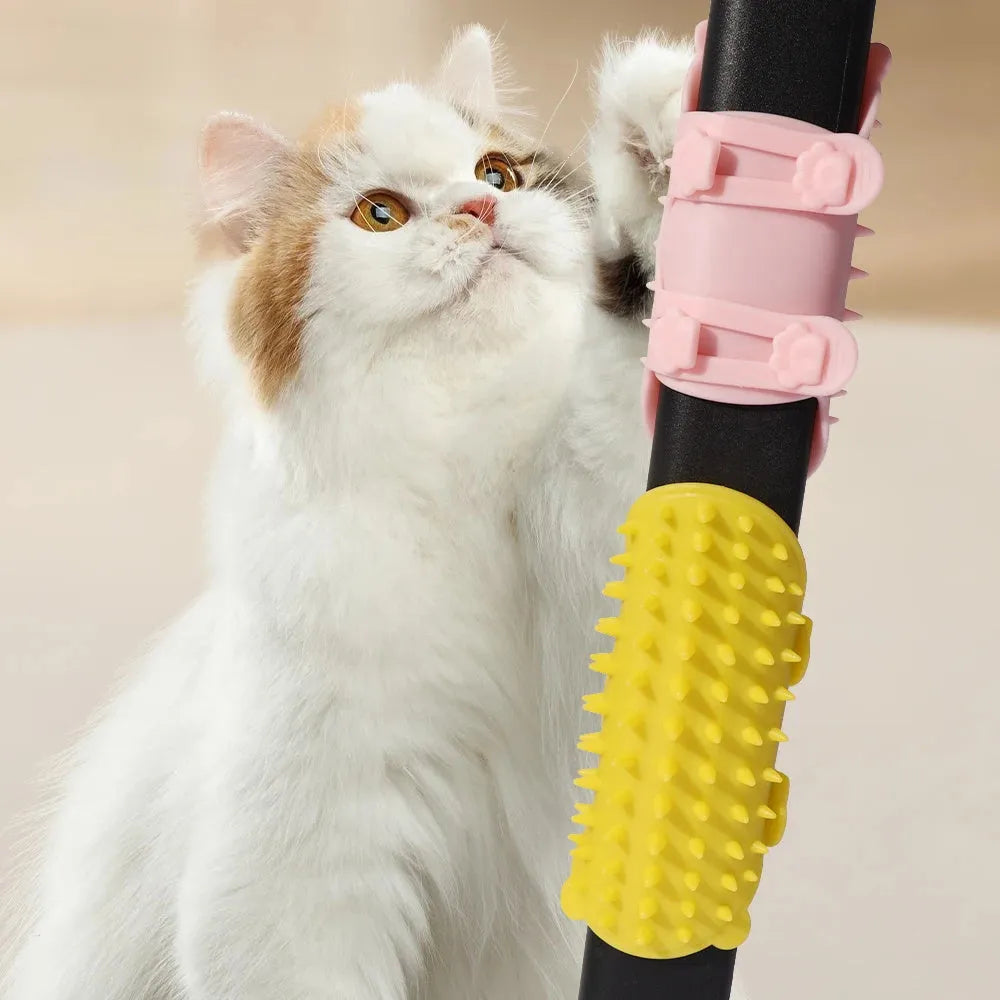 Silicone cat grooming comb with adjustable strap attached to table leg for hair removal and scratching relief