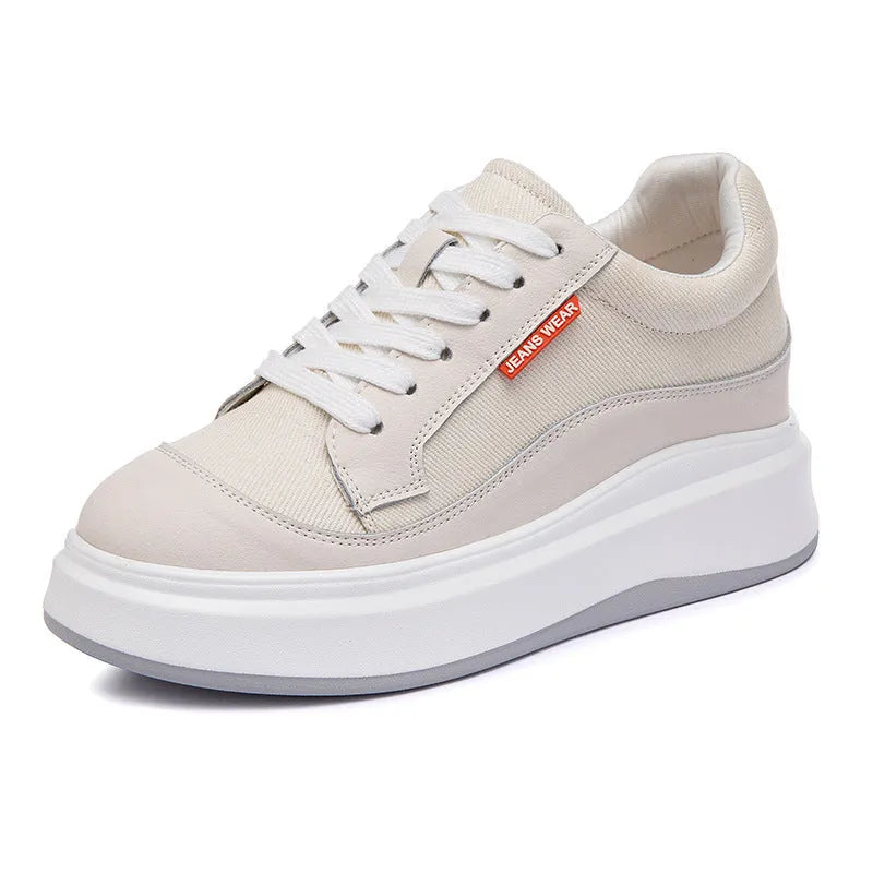 Women's pink leather board shoes with thick flat soles on a neutral background.