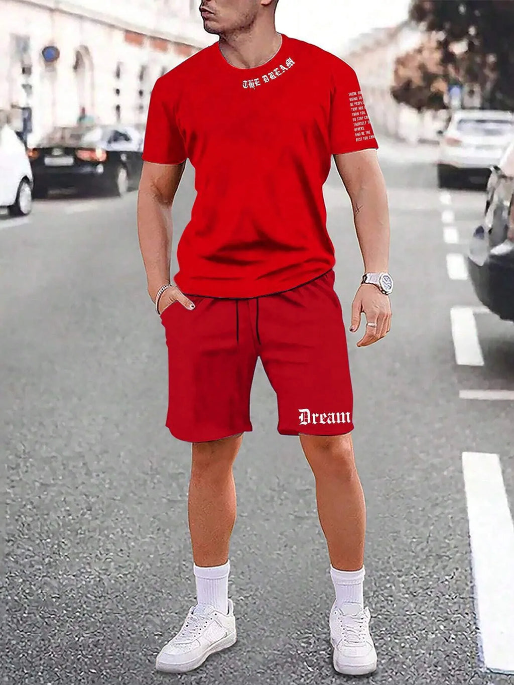Mens blue sports style short sleeve top and shorts two-piece set on a plain background.