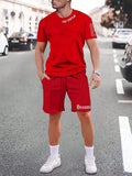 Mens blue sports style short sleeve top and shorts two-piece set on a plain background.