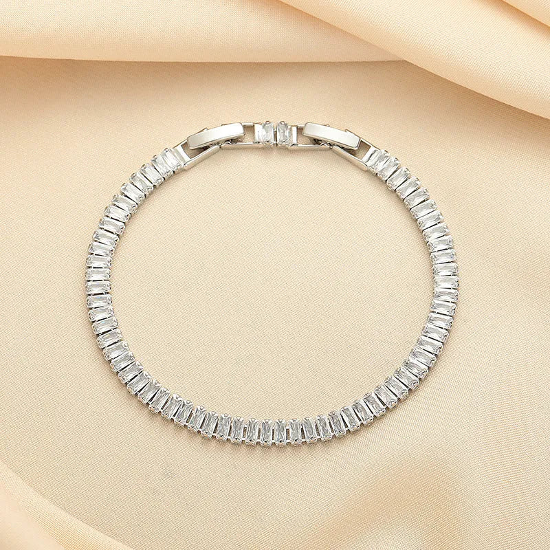 Geometric shape brass bracelet with full diamond zircon inlay in champagne gold colour.