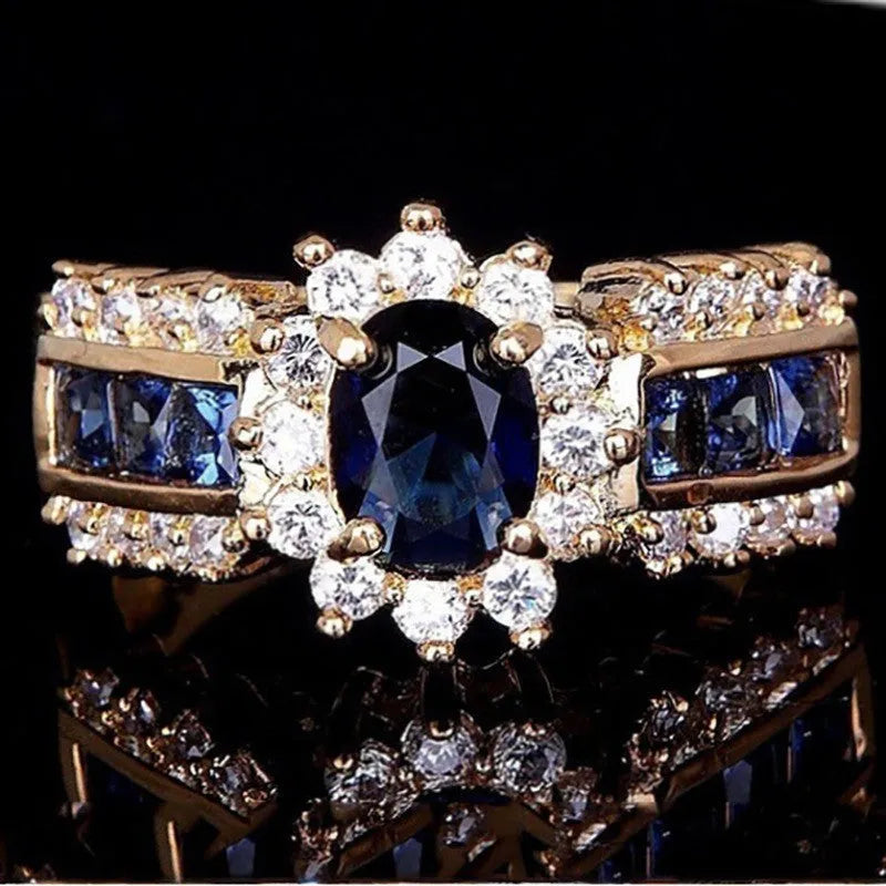 Personalised zinc alloy ring for men and women in a choice of three designs: sunflower blue diamond, square blue zircon, or square purple zircon.