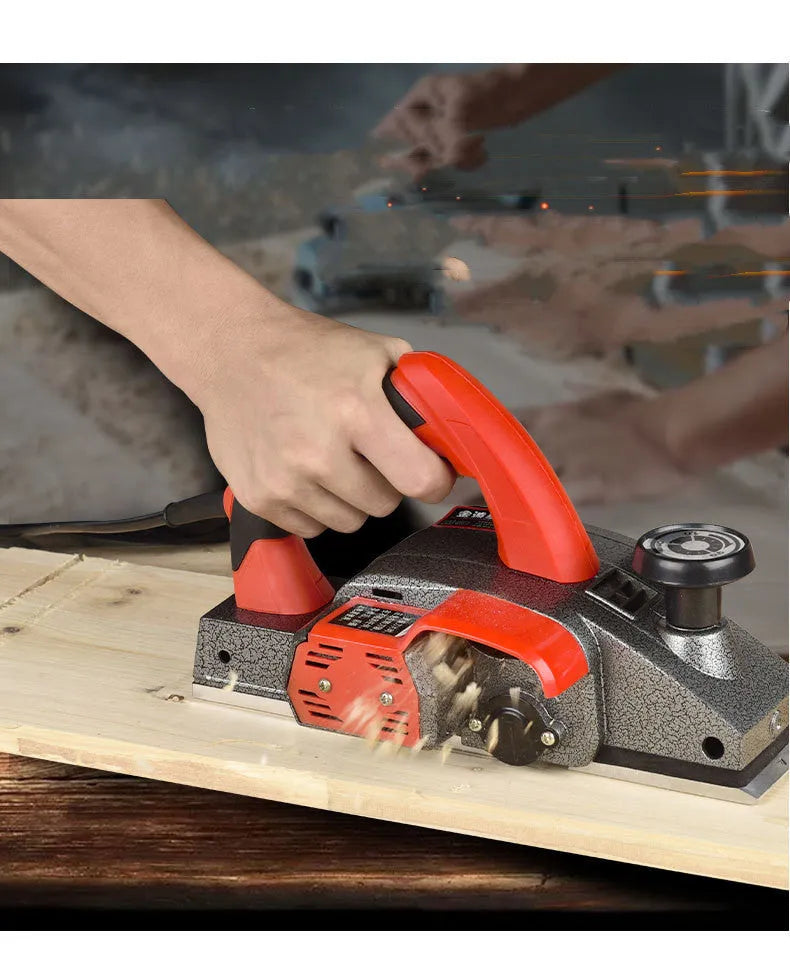Red electric wood planer tool with aluminium body for carpentry work