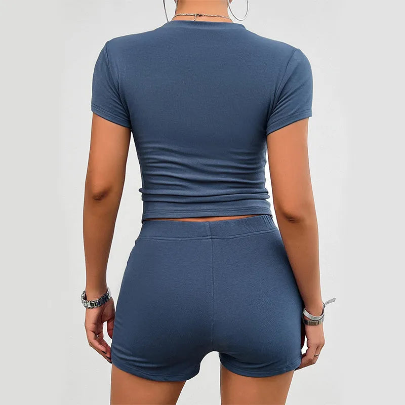 Women's solid colour viscose two-piece sports set with short-sleeve T-shirt and elastic shorts.