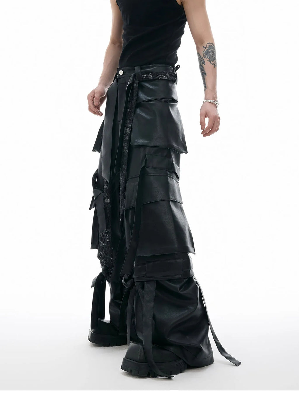 Black loose-fit men's trousers with quilted panels and multiple pockets.