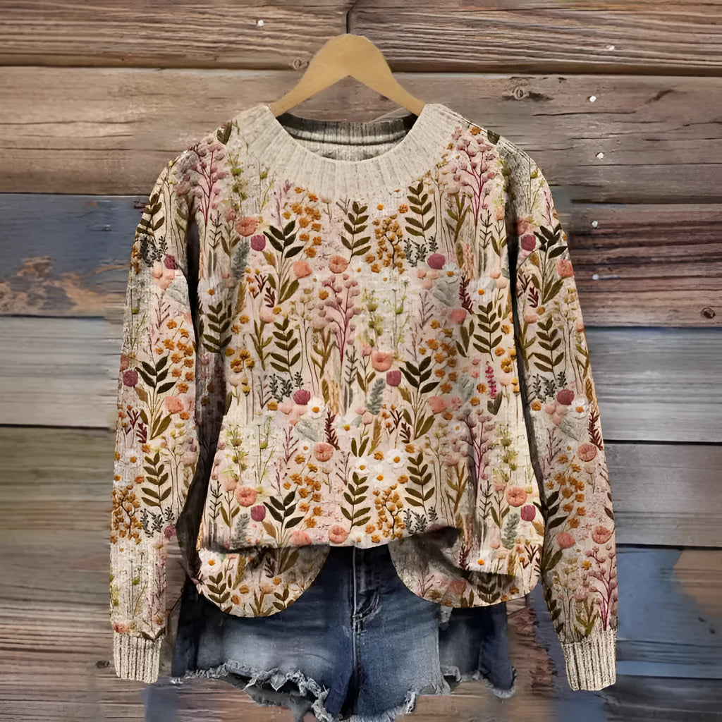 Women's grey round neck sweater with a small white digital flower print pattern.