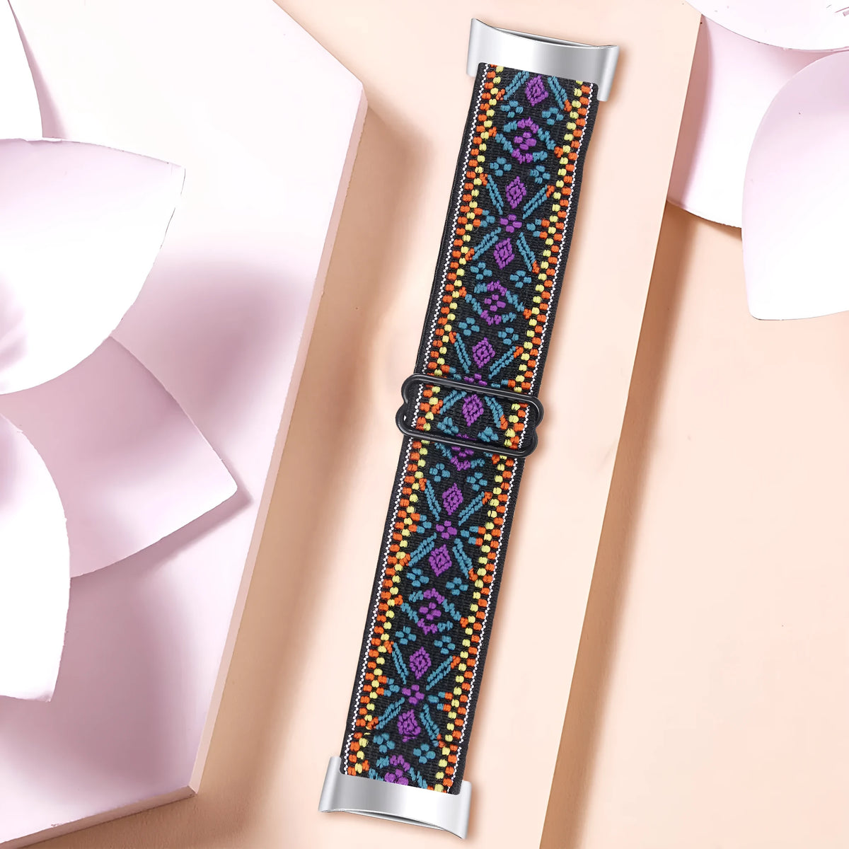 Printed elastic watch strap for Fitbit Charge 6 showing adjustable design and pattern options