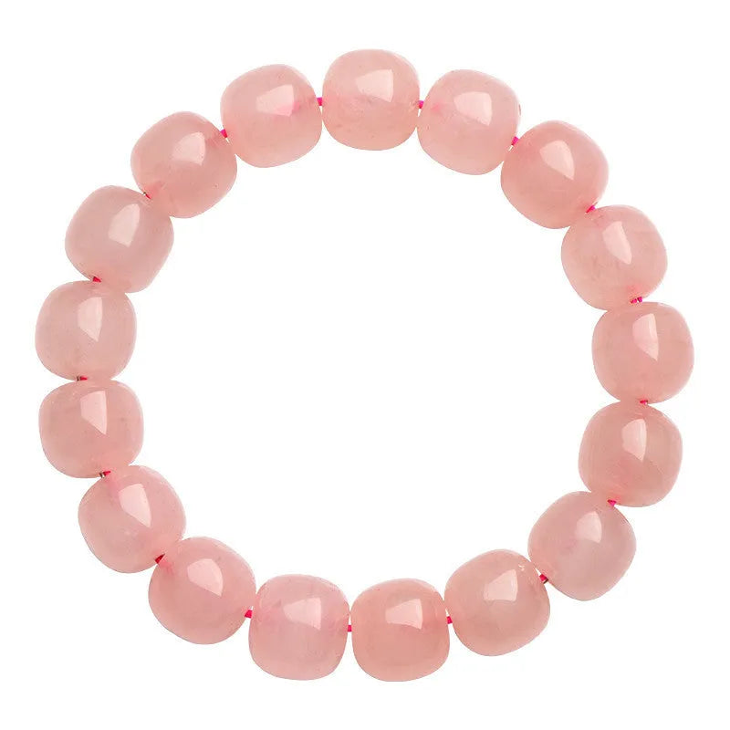 Pink natural crystal barrel bead bracelet with polished 8-10mm gemstone beads on wrist