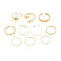 Gold colour openwork flower set ring with detailed floral design and glossy electroplated finish