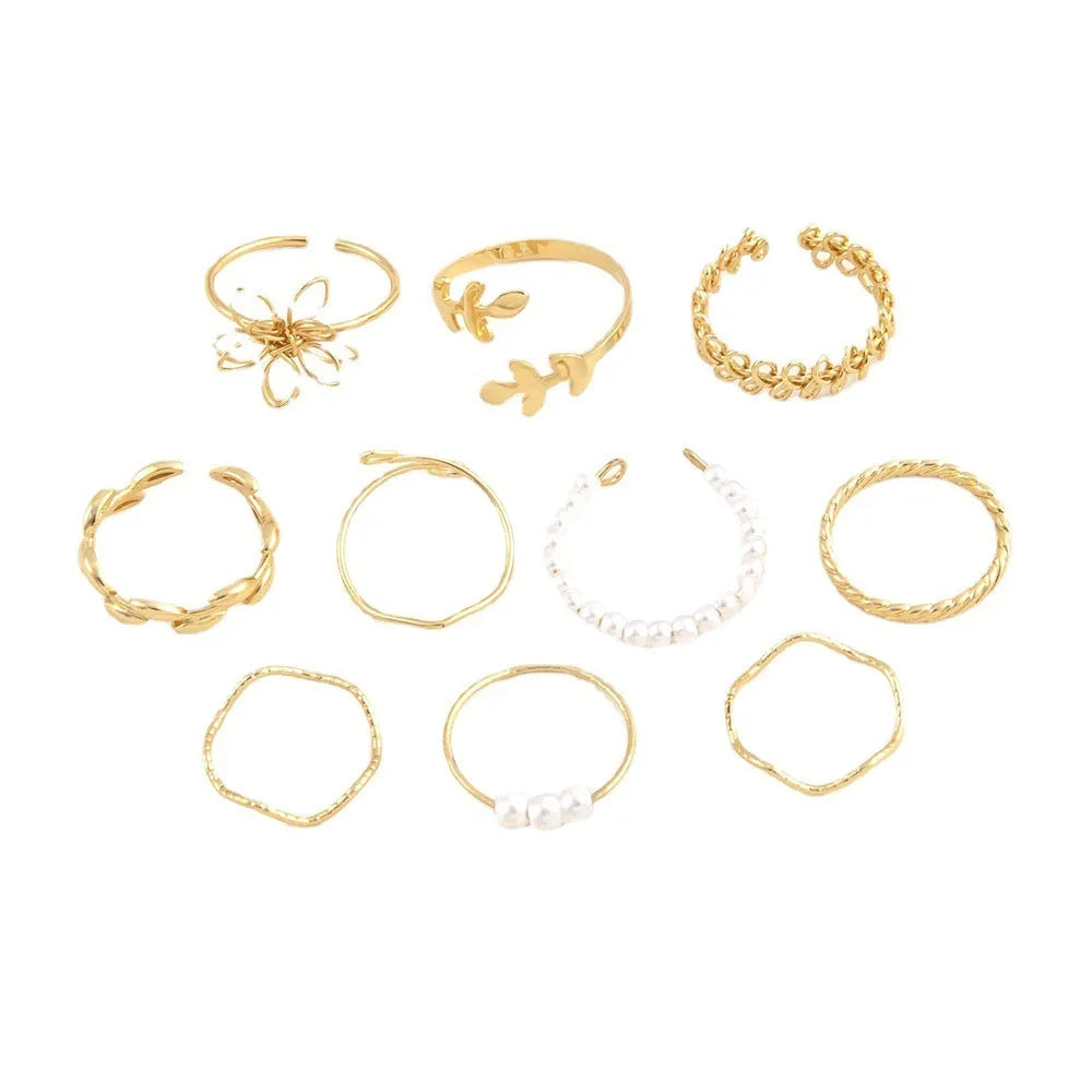 Gold colour openwork flower set ring with detailed floral design and glossy electroplated finish
