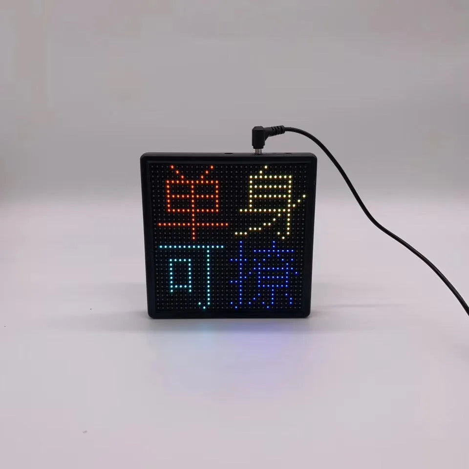 Square LED car display screen with aluminium frame showing 32x32 pixel RGB matrix and Bluetooth connectivity
