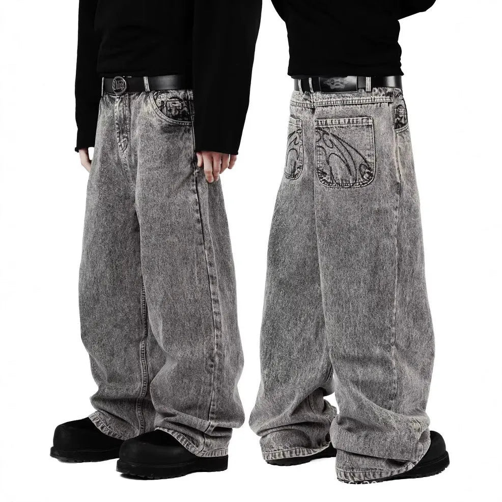Grey loose straight-leg cotton denim trousers on a hanger