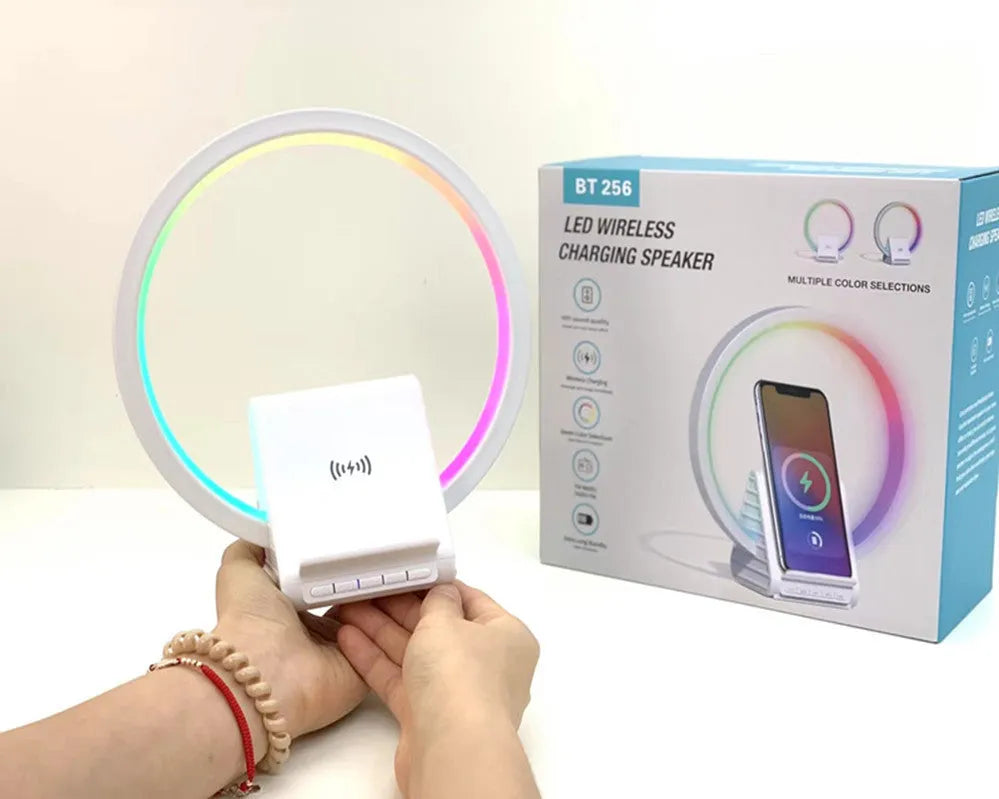 White smart Bluetooth speaker and wireless charging pad with ambient light, showing slim 10mm profile