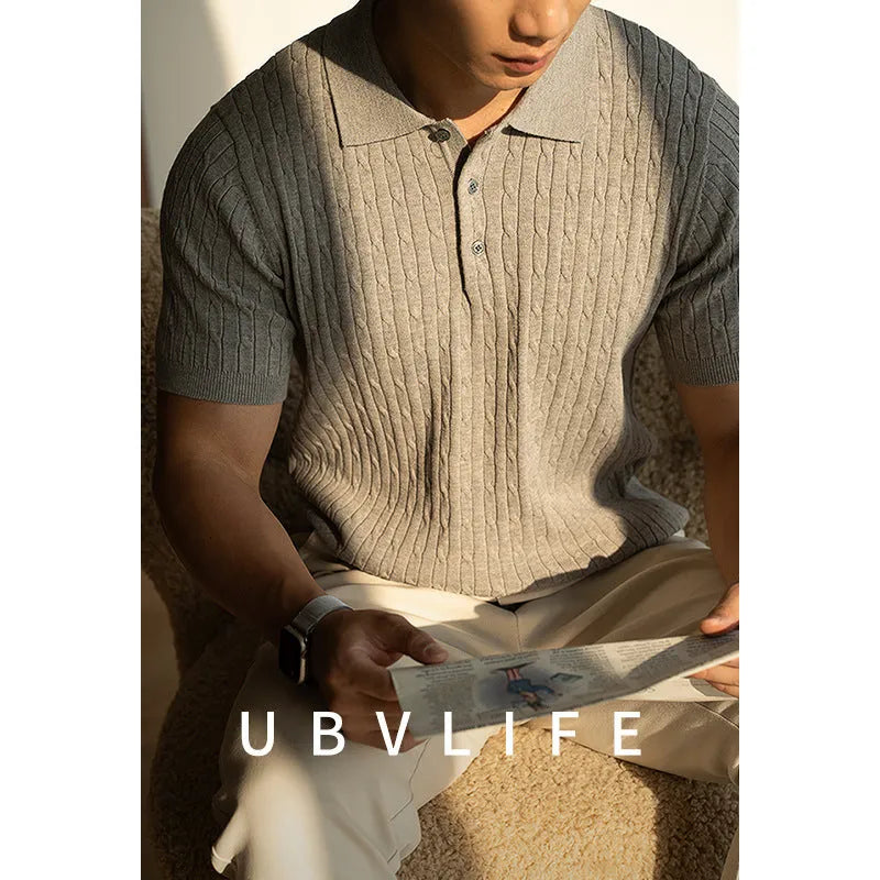 Men's khaki short sleeve business casual top laid flat, showing collar and sleeve detail.