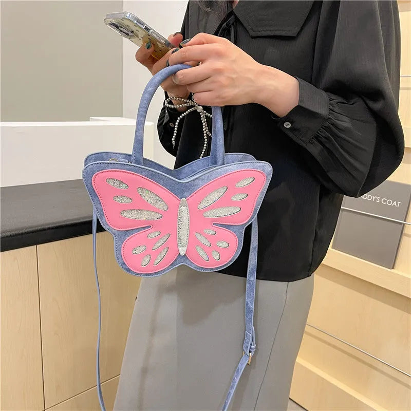 Small square crossbody bag in PU material showing contrast colour detailing and adjustable strap
