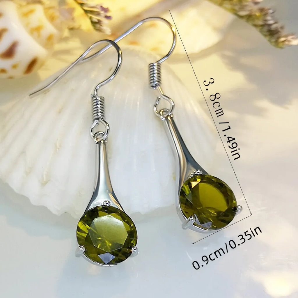 Olive green topaz earrings with water drop shape and retro design on alloy background