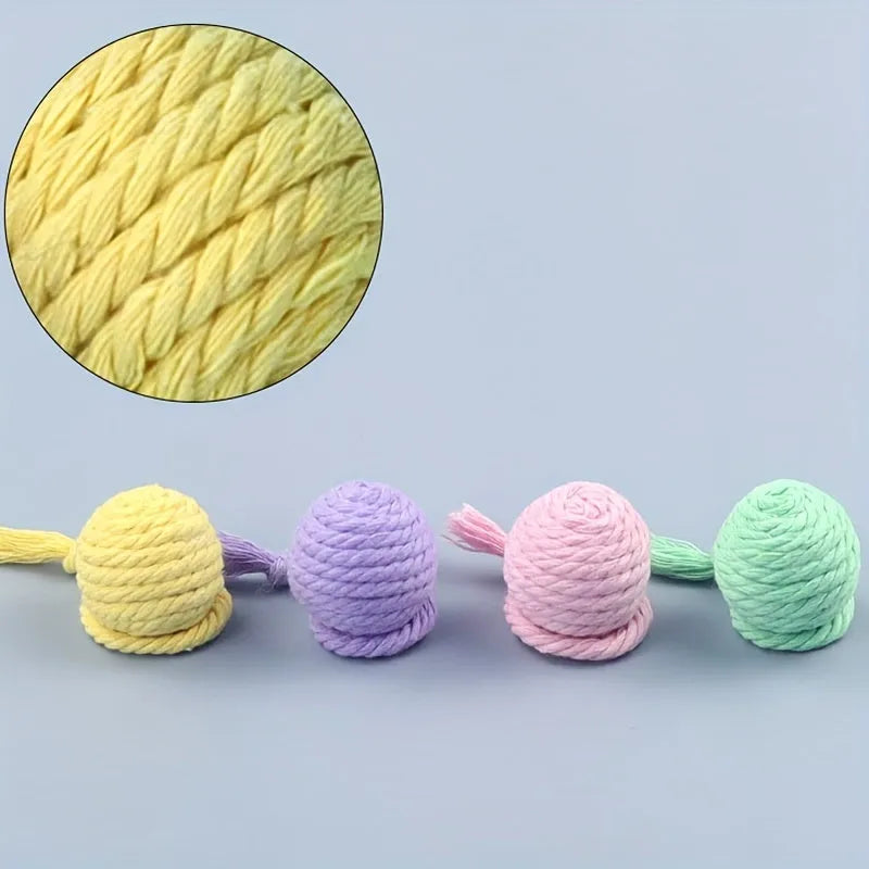 Colourful cat toy ball with rope and internal bell in small and medium sizes.
