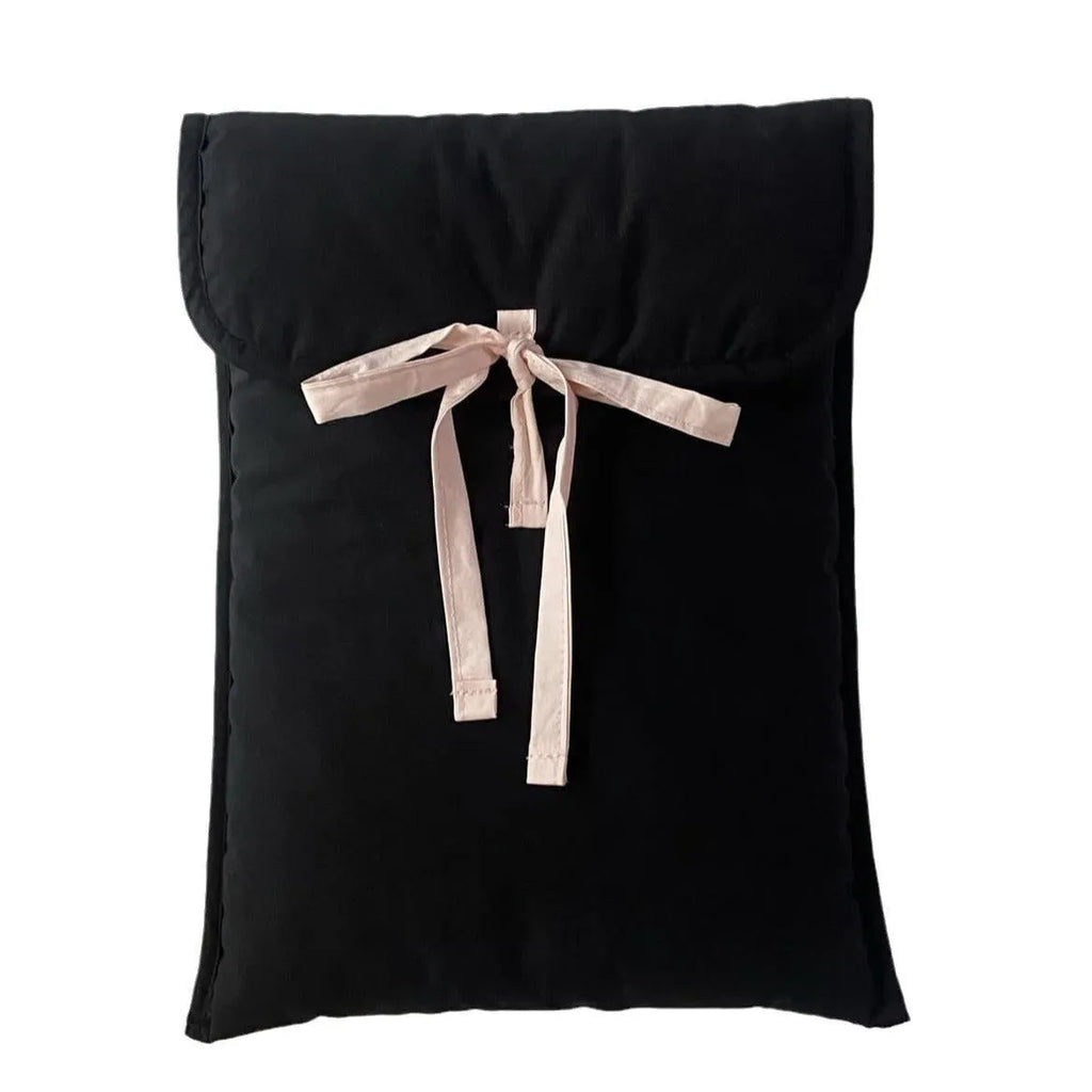 Women's black quilted computer bag with ballet style bow and striped pattern