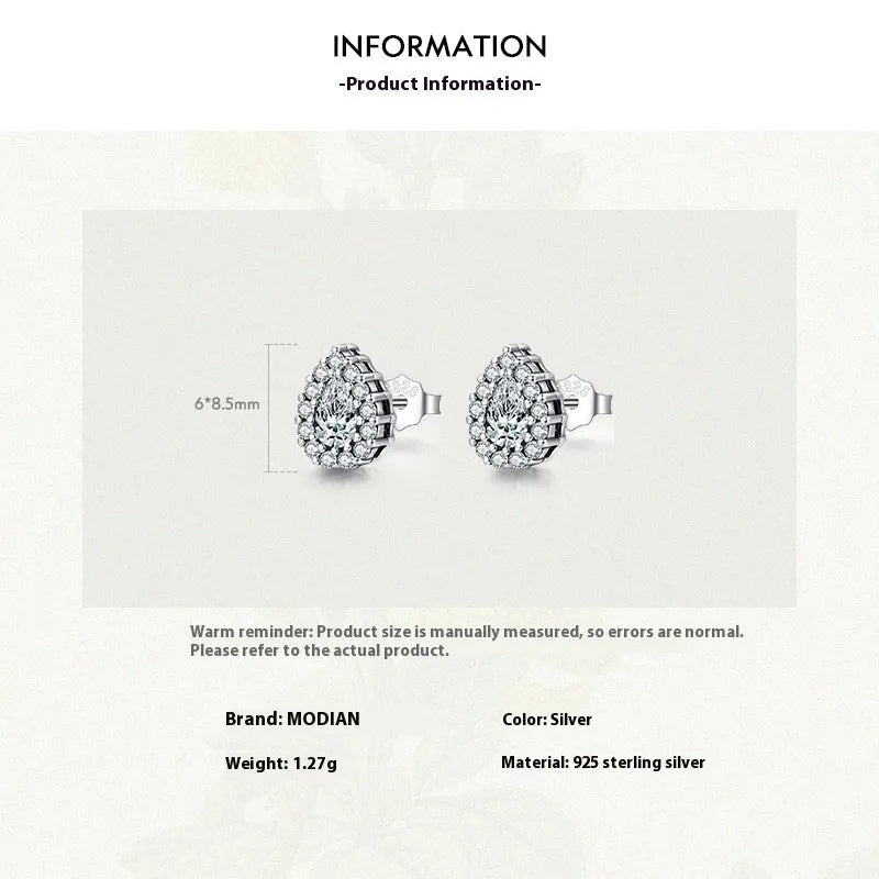 A pair of women's sterling silver water drop ear studs with a diamond-cut shiny finish.