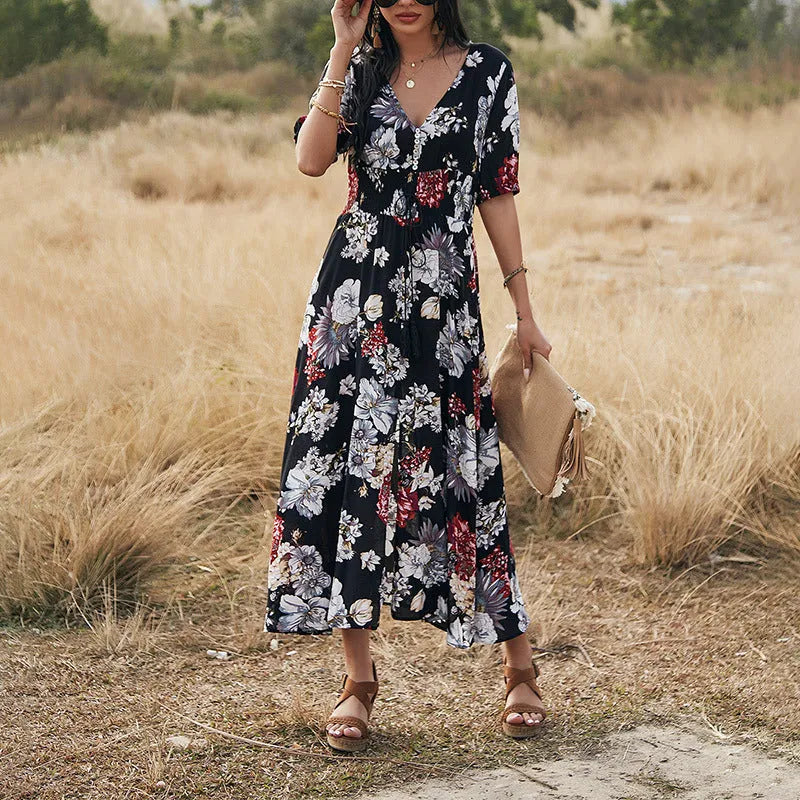 Yellow floral print summer dress with V neck and elastic waist on mannequin