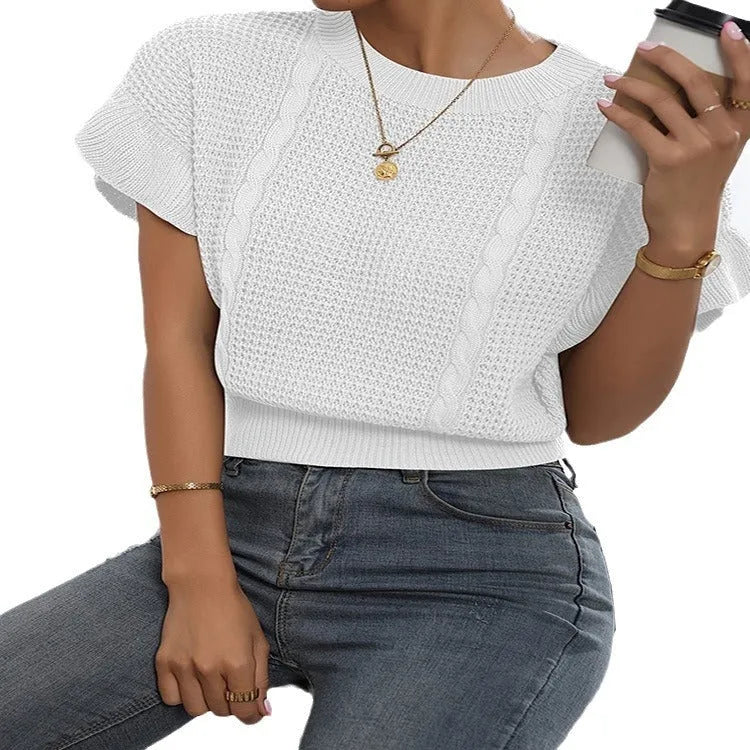 Knitted pullover sweater with ruffled short sleeves and twisted string detail in a loose fit.
