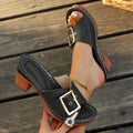 Women's black retro chunky heel beach slippers with a metal buckle detail on the upper.