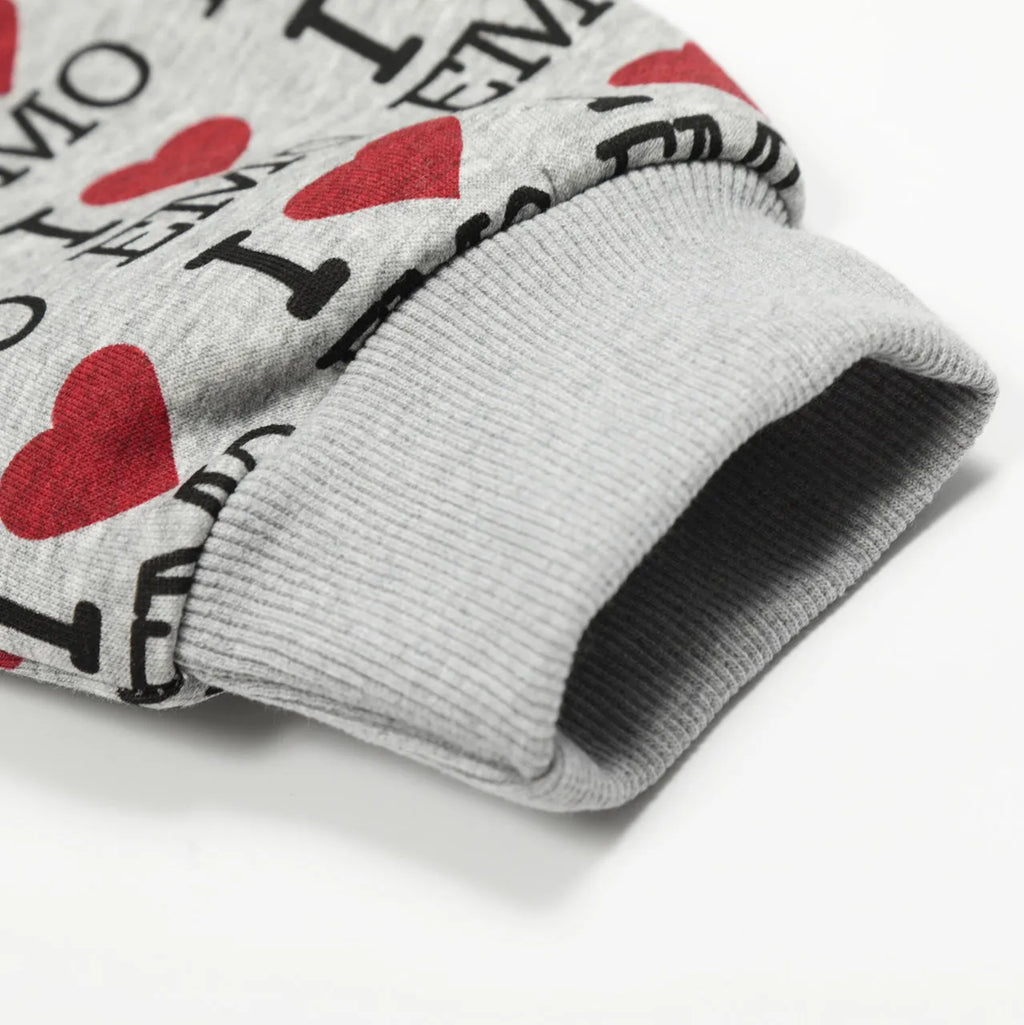 Women's melange grey cotton cardigan sweater with long sleeves on a hanger.