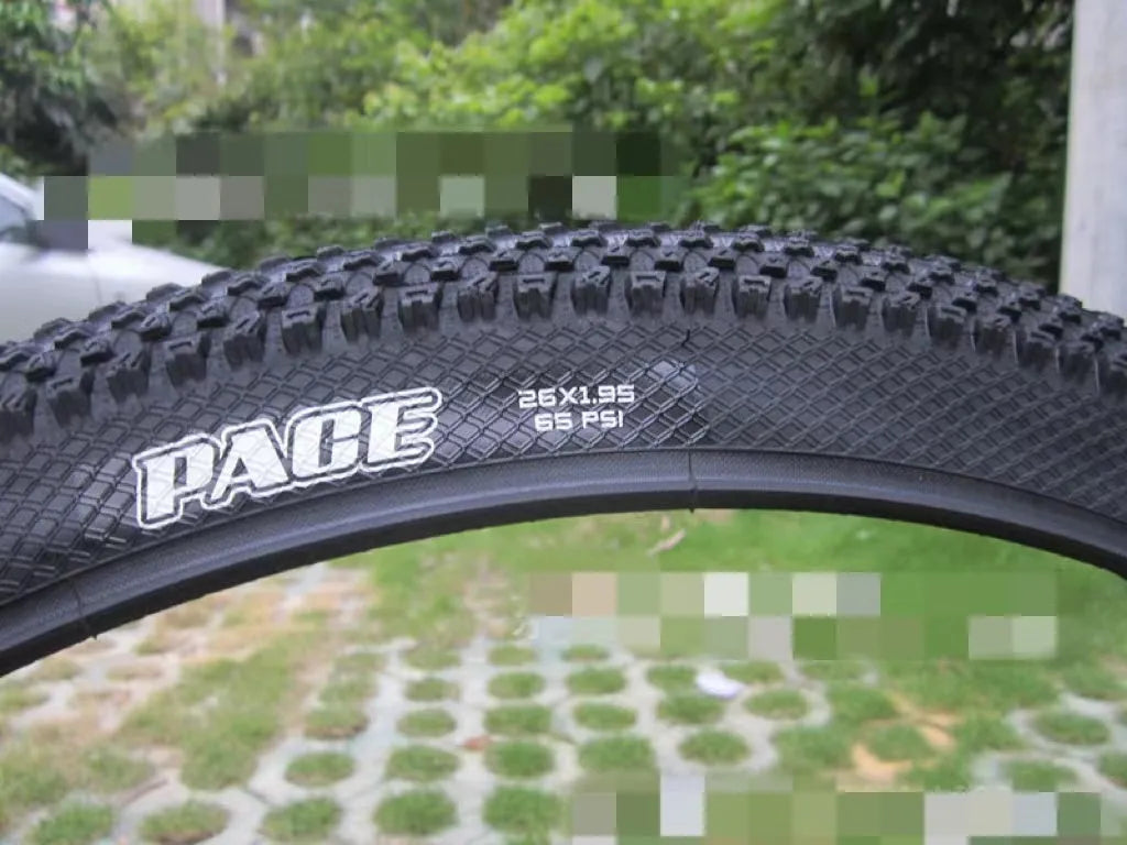 Ultralight black mountain bike tyre with puncture proof tread, shown in 26, 27.5 and 29 inch sizes.