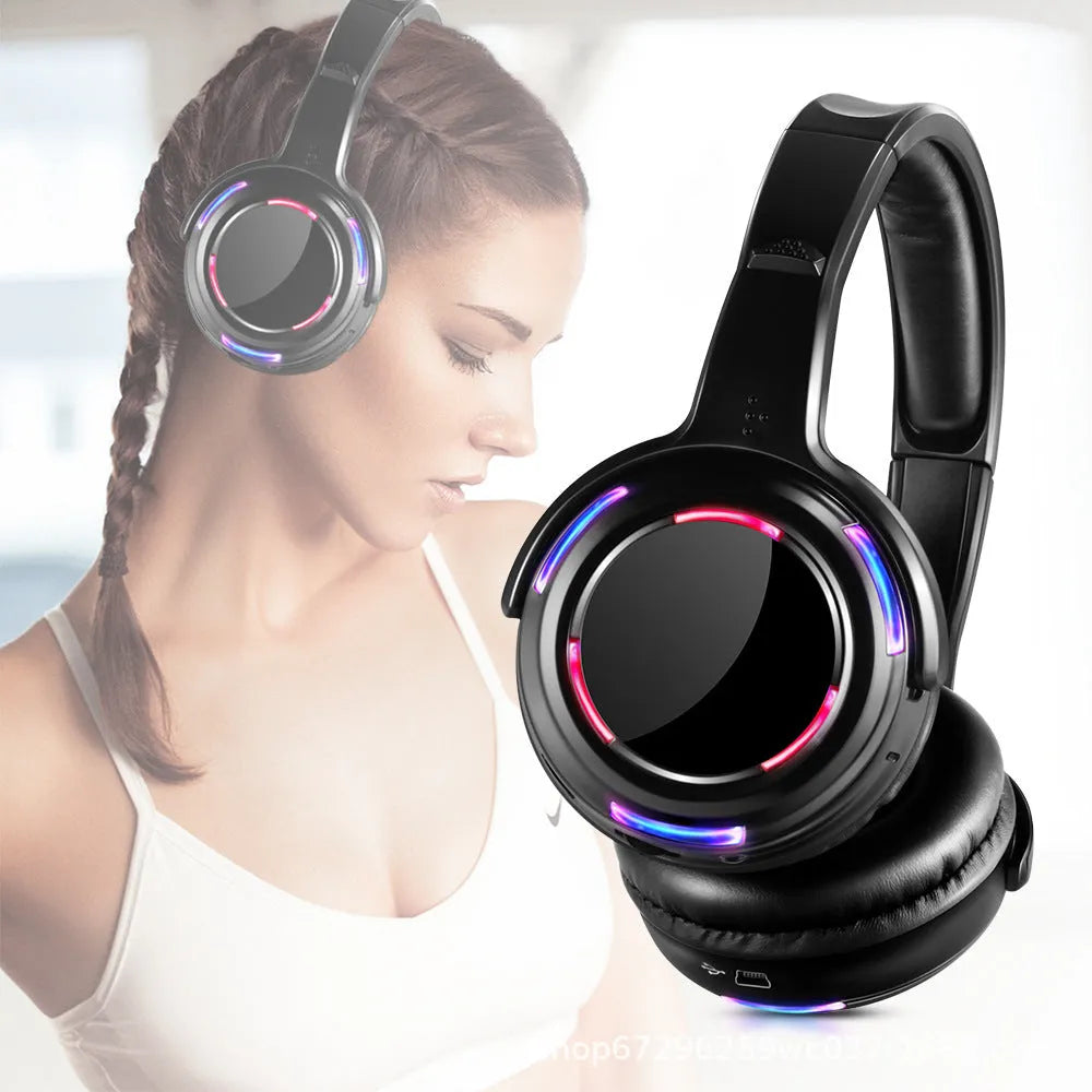 Black over-ear silent disco wireless headphones with a 3.5mm cable, shown on a head model.
