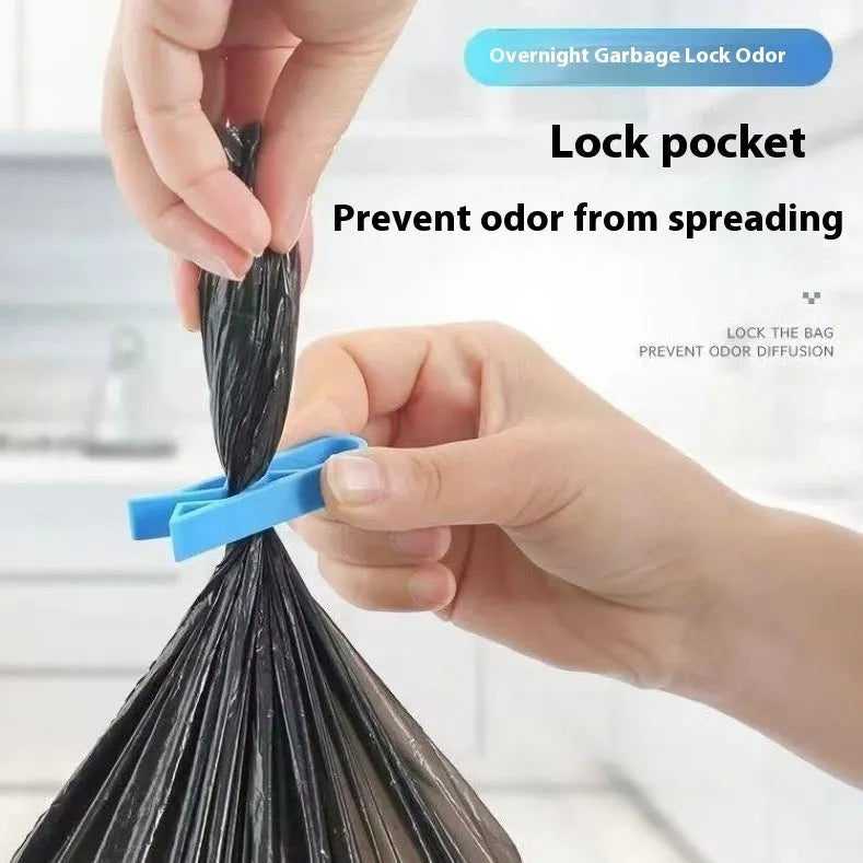 Grey PP plastic non-slip clip for securing bin bags to a rubbish bin rim.
