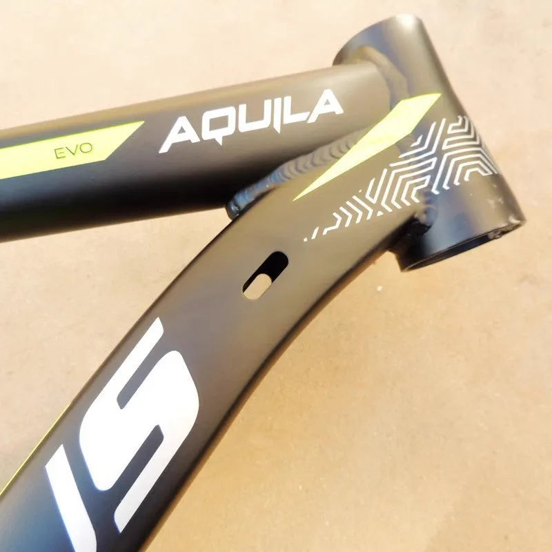 Black green aluminium 29-inch mountain bike frame showing disc brake mount and internal cable routing ports.