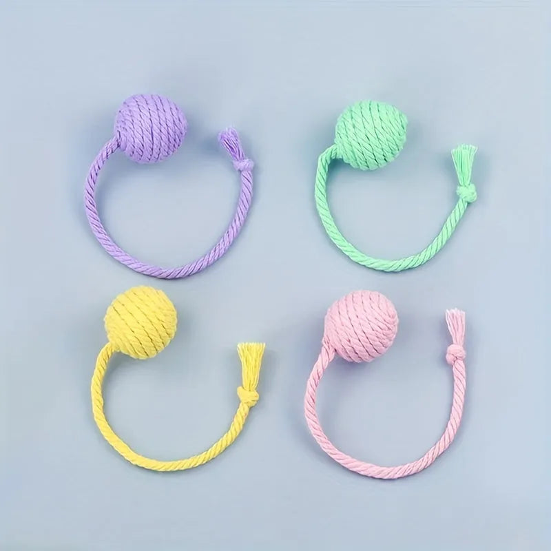 Colourful cat toy ball with rope and internal bell in small and medium sizes.