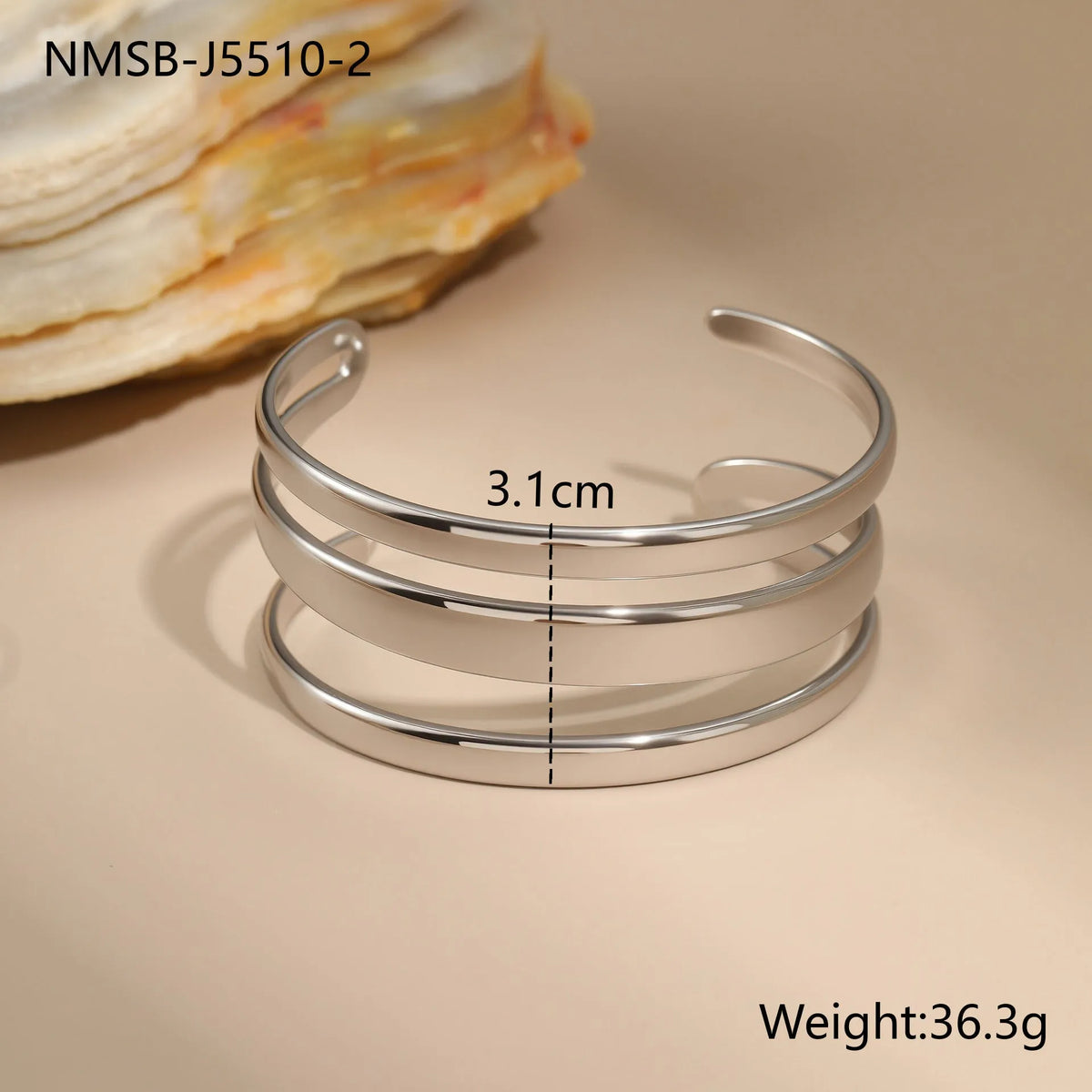 Stainless steel geometric open bracelet for women in gold or silver electroplated finish.