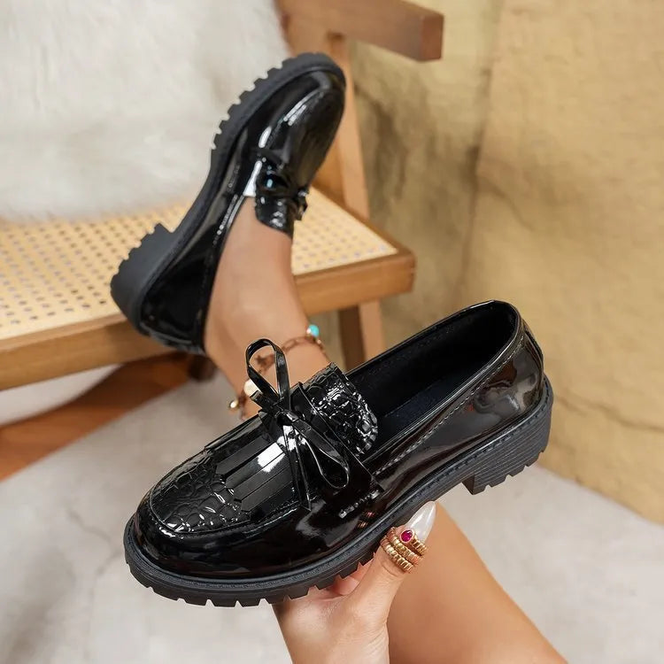 Women's brown loafers with decorative bow detail on artificial PU leather upper