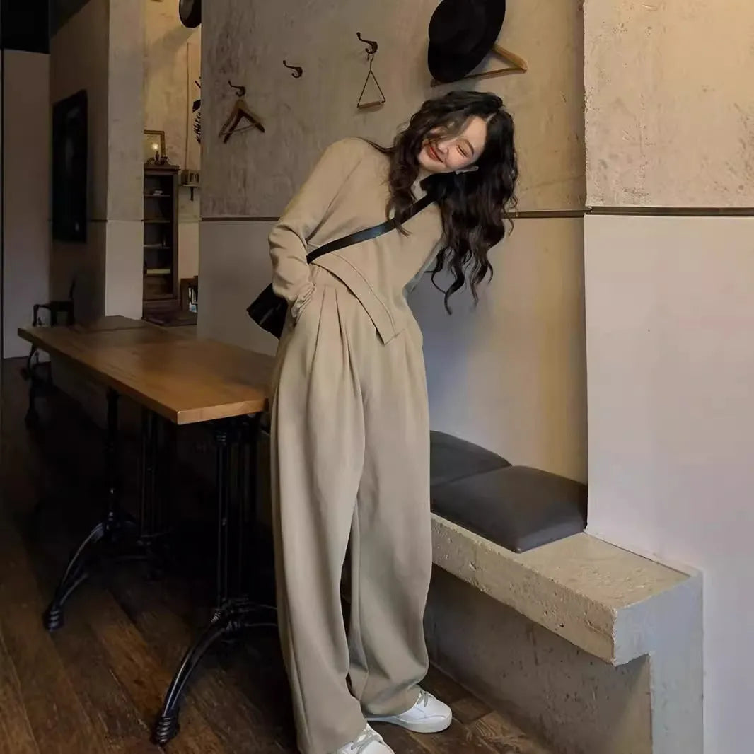 Brown loose-fit women's polyester sports suit with long sleeves and full-length trousers.