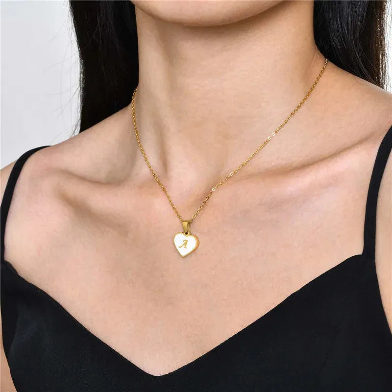 Gold-plated heart-shaped white shell necklace with adjustable chain and letter personalisation option