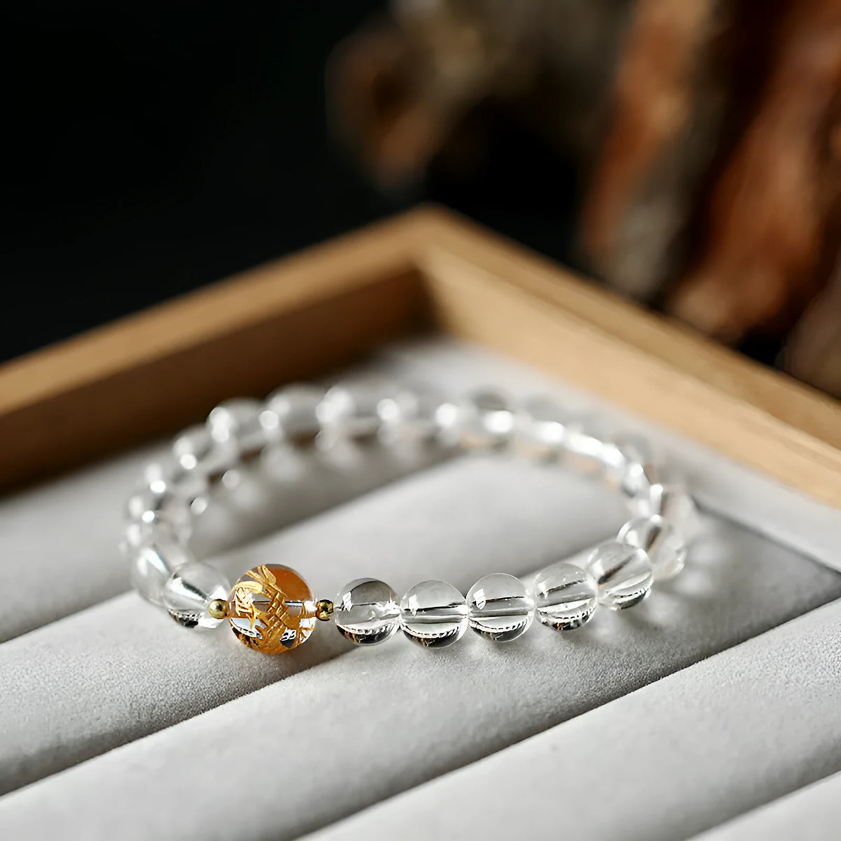 Geometric obsidian and white crystal beaded bracelet with gold dragon charm for 14-16cm wrist.