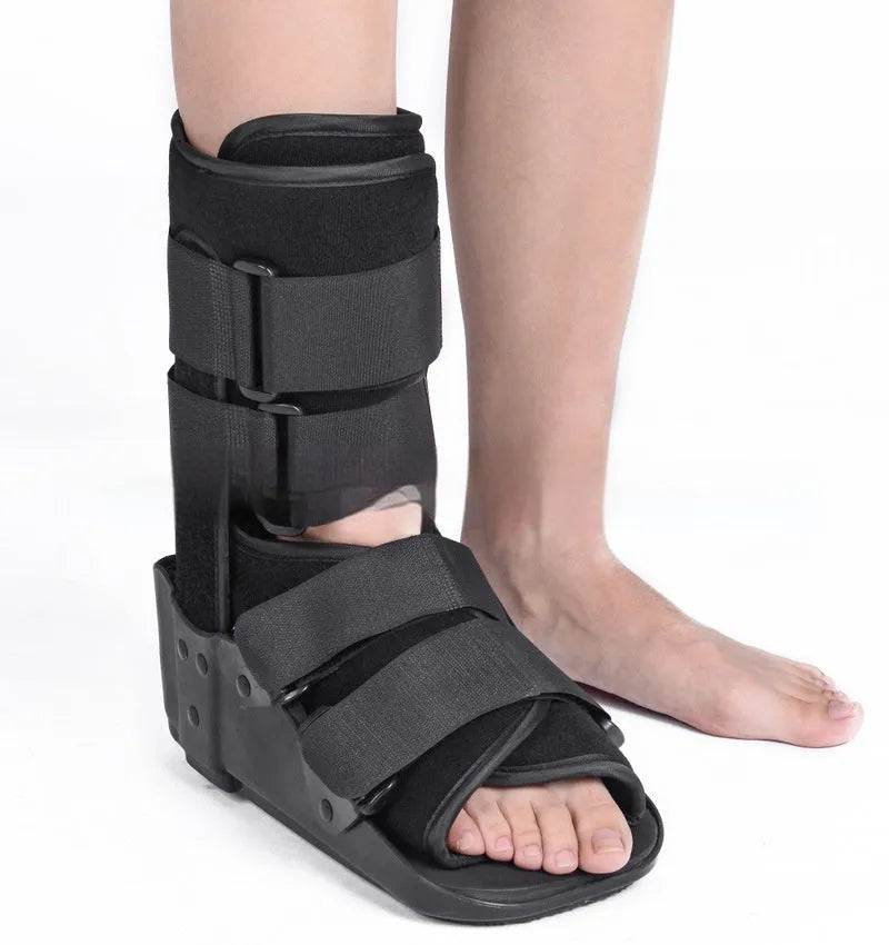 Grey and black Achilles tendon rehabilitation fixed support walking boot with adjustable straps.