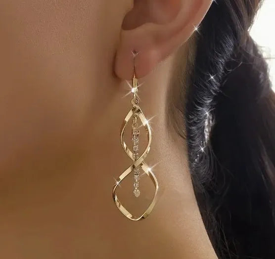 Gold spiral geometric earrings for women with ellipse detailing on alloy metal