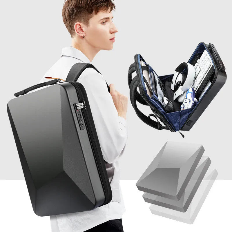 Hard shell PC gaming backpack showing lock opening, dual straps, and organisational compartments in black colour