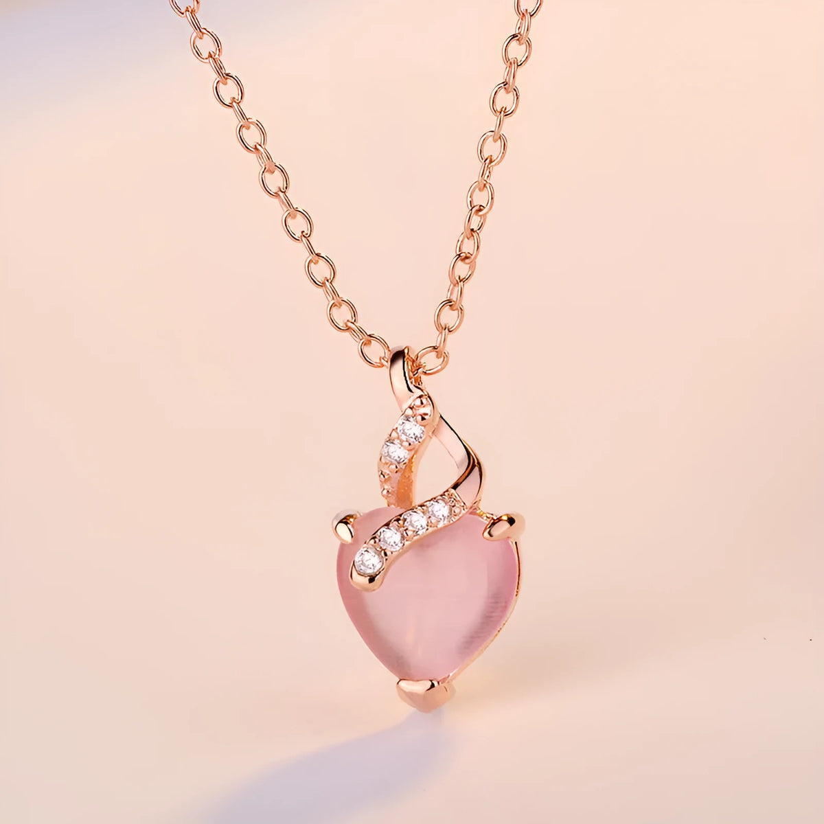 Women's heart-shaped pink crystal pendant necklace on rose gold electroplated chain