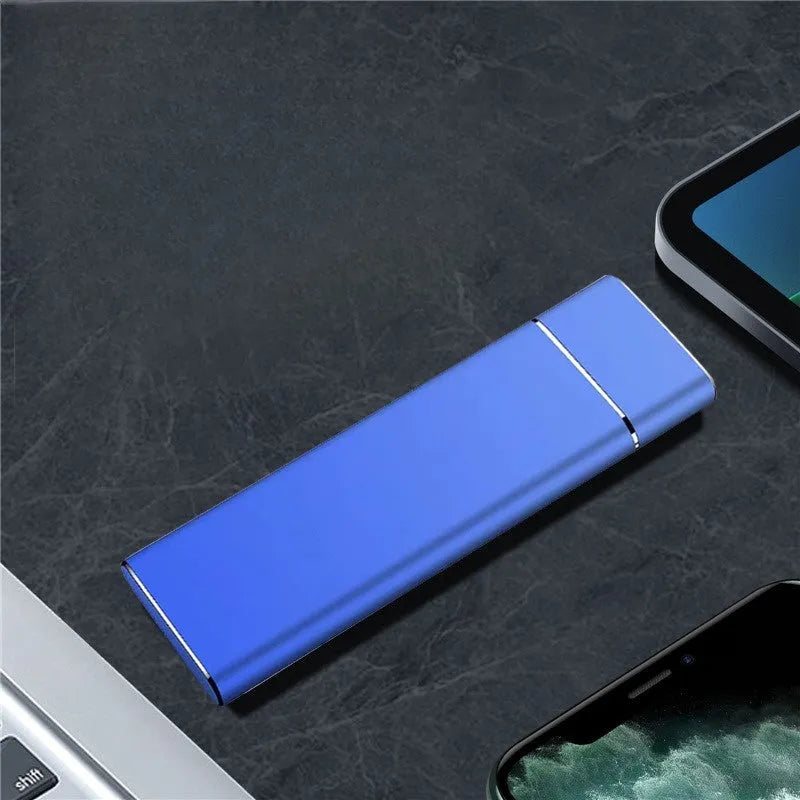 Sapphire blue portable external hard drive with metal shell showing USB connection cable