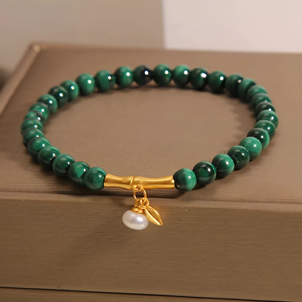 Women's white crystal bamboo bracelet showing adjustable design with bead arrangement