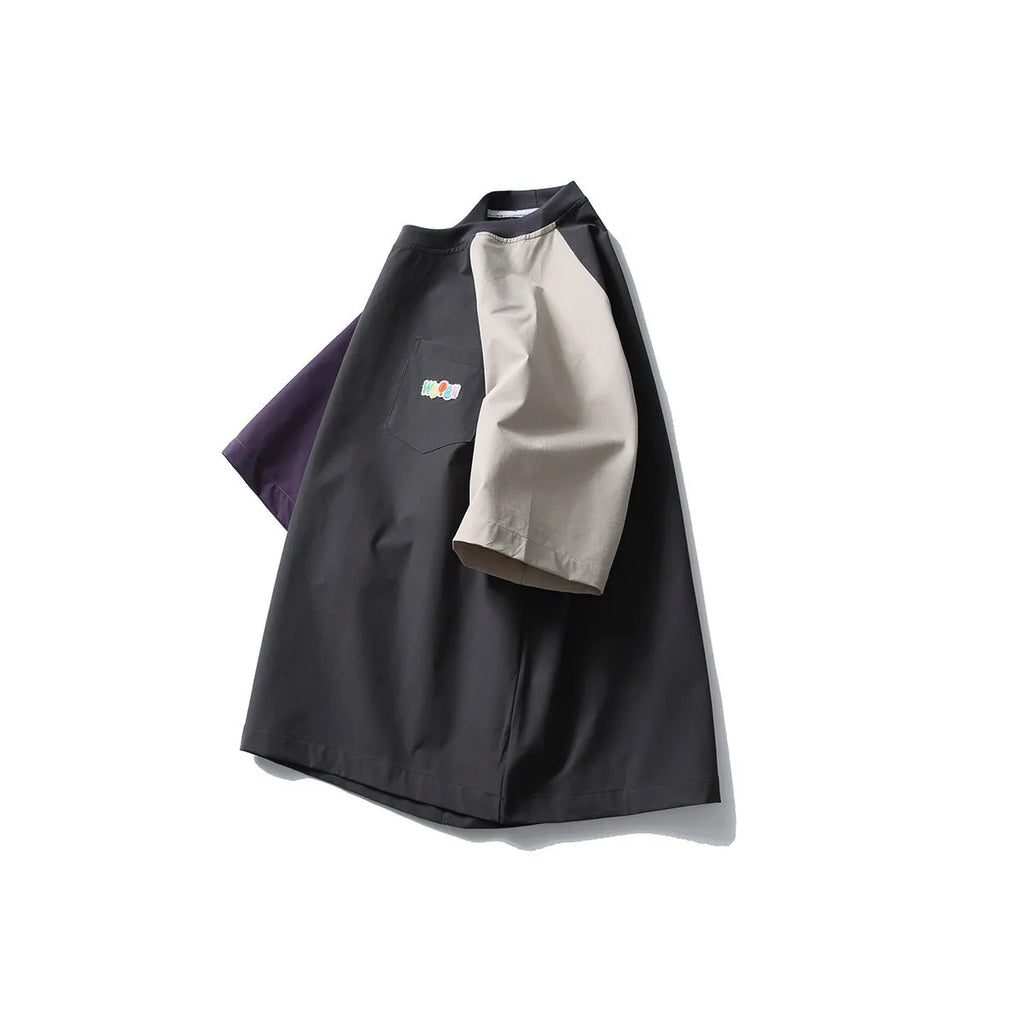 Dark grey loose-fit T-shirt with contrast colour raglan sleeves showing quick-drying polyester construction