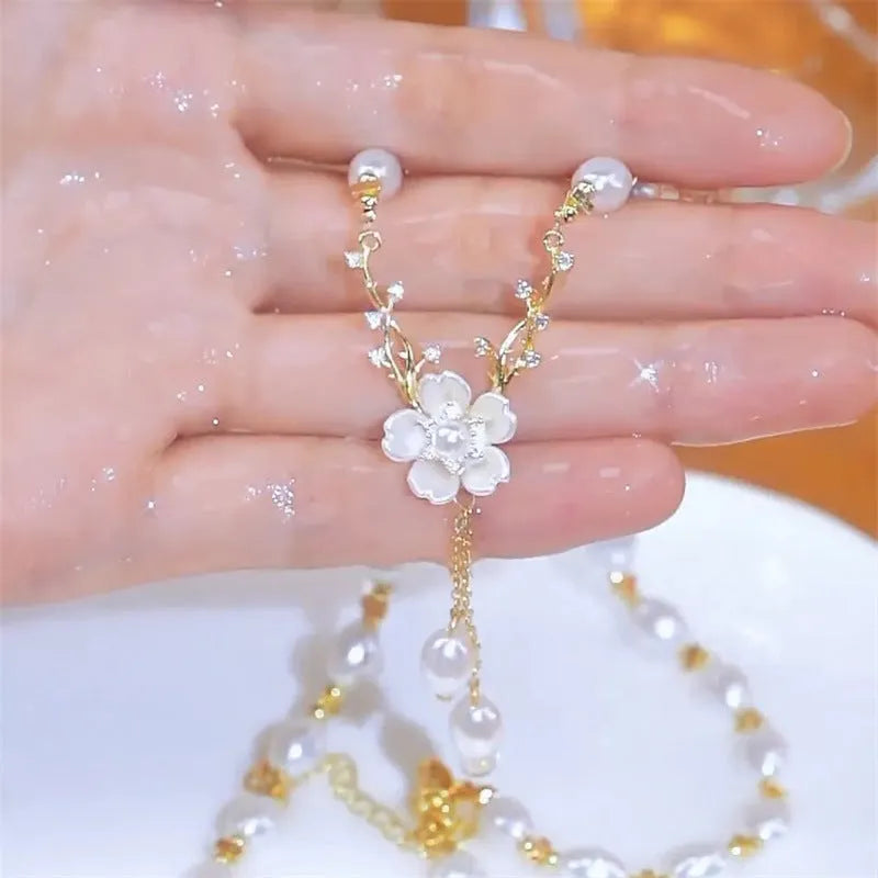 Alloy fashion necklace with pearl flower pendant featuring rose detailing in pearl flower colour