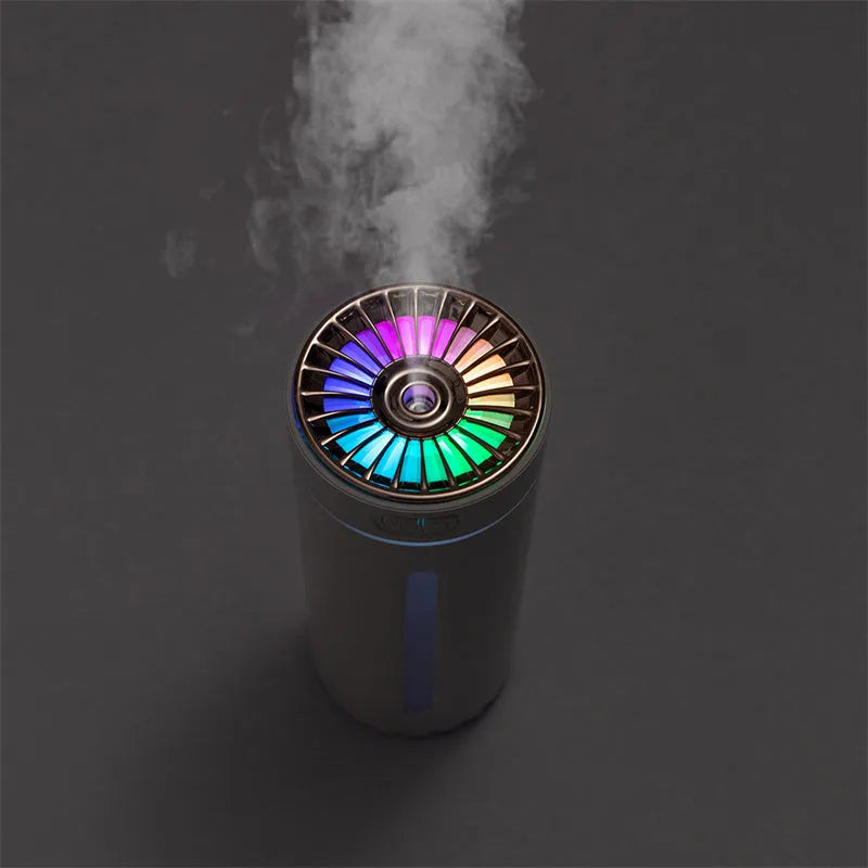 Black wireless USB humidifier with colourful lights on a car dashboard cup holder